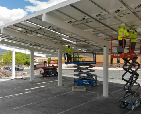 workers installing solar cart port