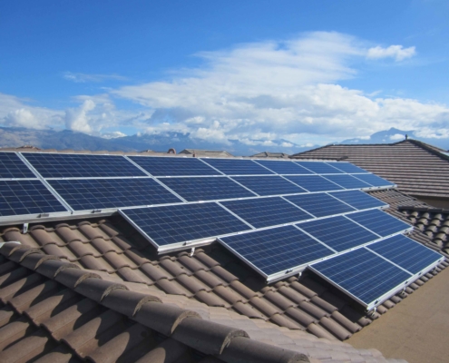 solar panels on roof with mountains in background