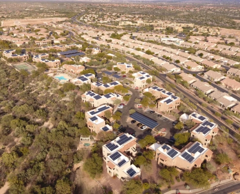 drone view of solar panels in community
